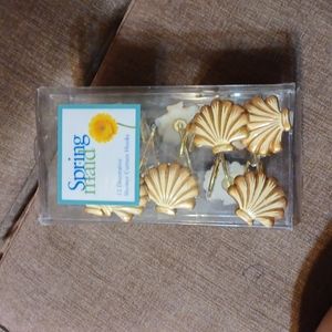 Spring made 12 decorative curtin hooks brand new in the box